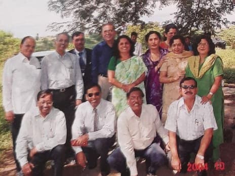 Fifteen members of the club, standing and kneeling in two rows for a group photograph outdoors at Phulgaon.